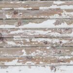 Maderas cracking and peeling white paint on a wall. vintage wood backgro