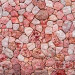 Piedras purple and pink marble stone wall texture background. closeup surface grunge stone texture, stonework rock old pattern clean grid uneven bricks design stack.