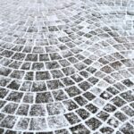 Piedras curved,gray,cement,block,pavement,with,snow