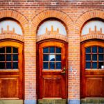Navidad old,vintage,wooden,doors,and,brick,wall,at,train,station