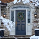 Navidad front,door,in,winter,with,seasonal,wreath,,surrounded,by,snow