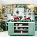 Navidad interior of green kitchen with christmas decor, tree and christmas lights